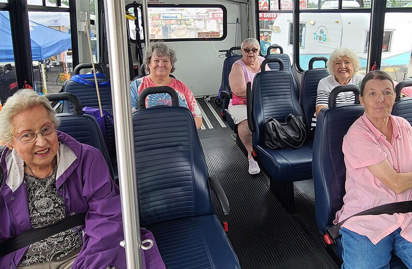 Senior women sitting in a transit vehicle