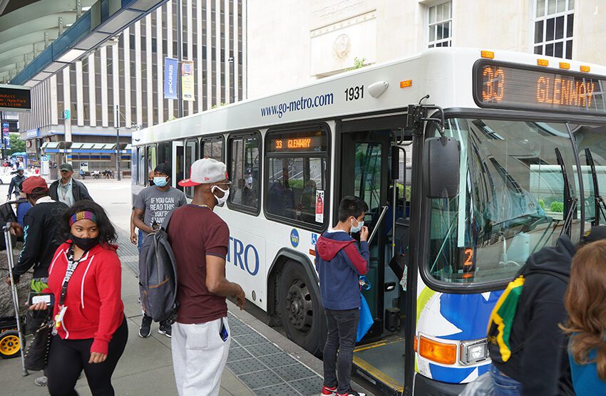 people boarding city bus