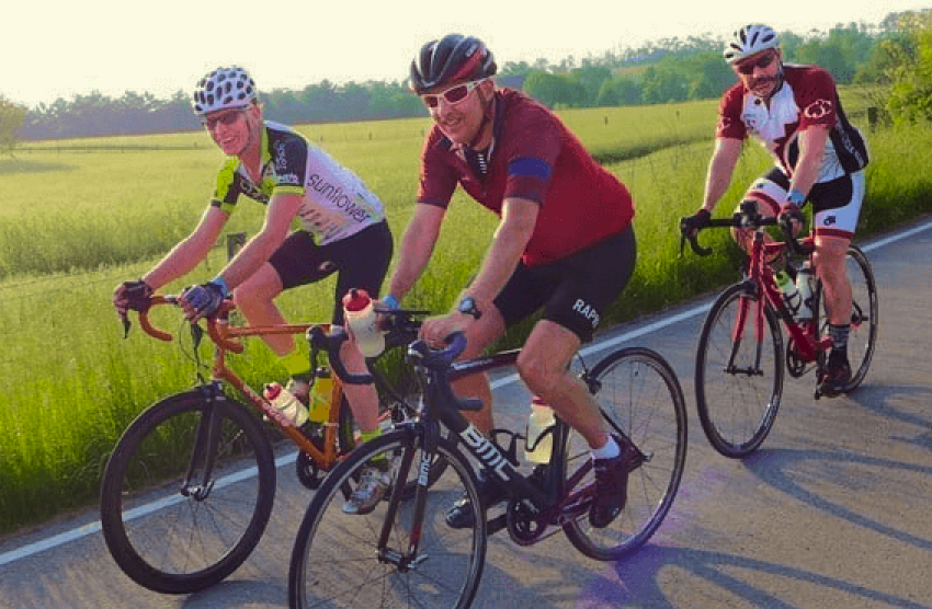 three bicyclists on trail