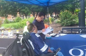 Man in wheelchair talking to a woman