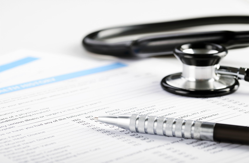 medical form and stethoscope