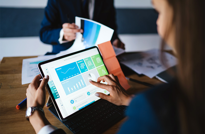 woman typing on touchscreen computer
