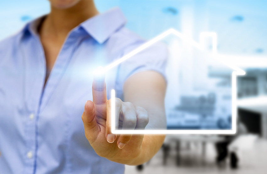 woman drawing a house with her finger