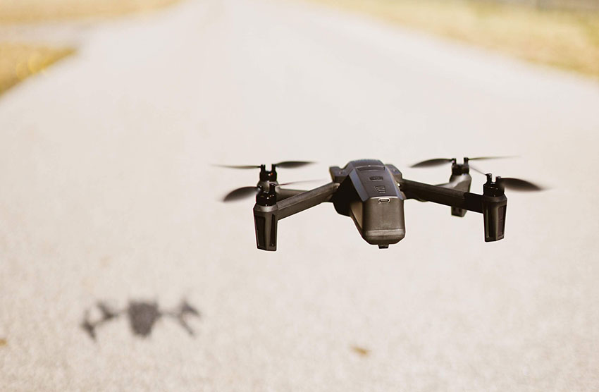 A UAV/Drone flying over a road